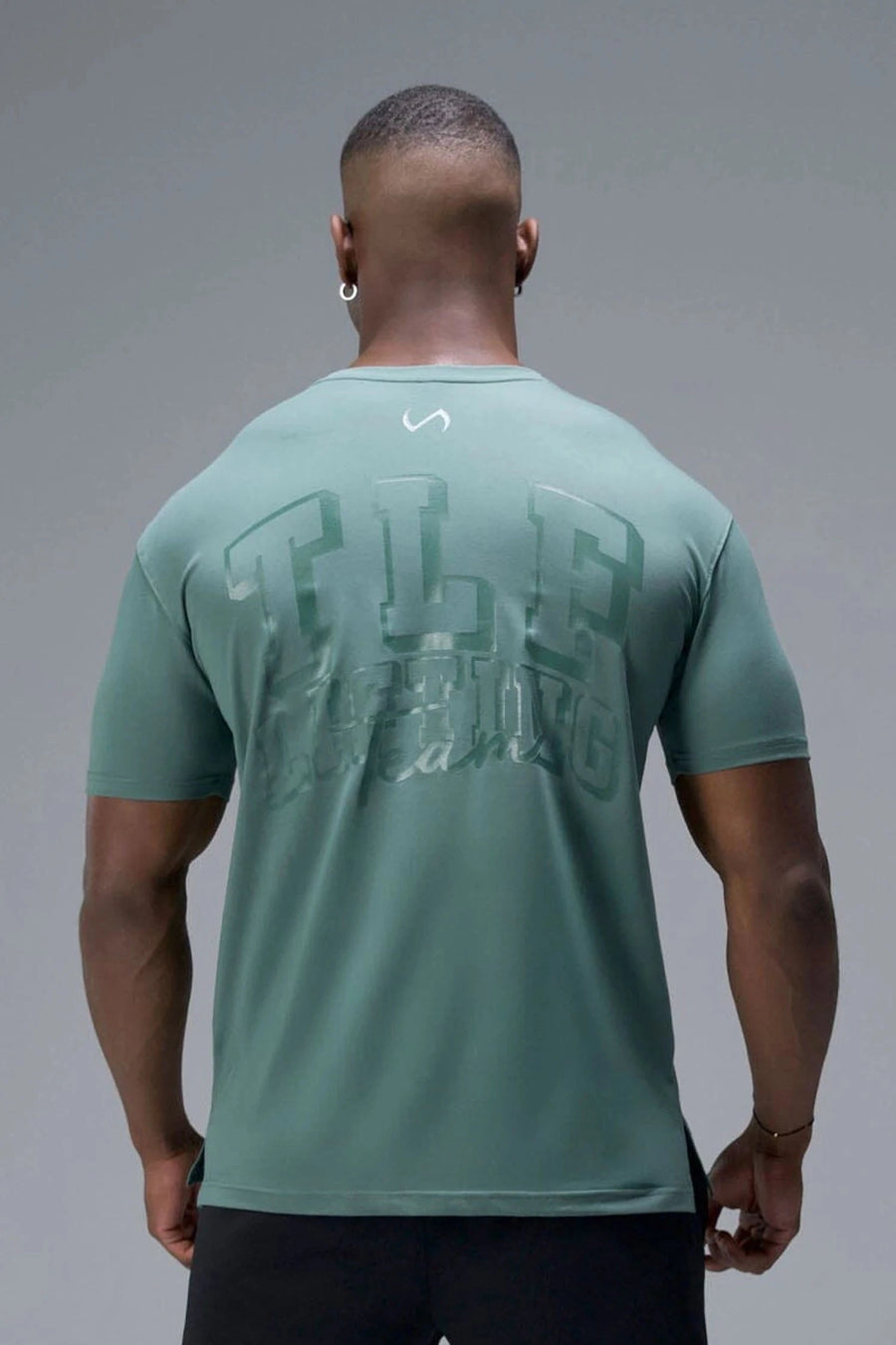 Back View of Green TLF Lifting Team Cotton Luxe Swole Tee, a gym shirt with a physique enhancing fit and a tonal graphic print 