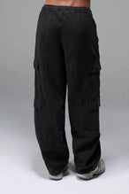 Back View of Black the TLF Low Rise Oversized Cargo Joggers featuring a low-rise waistline, oversized & baggy fit and snap button cargo pockets