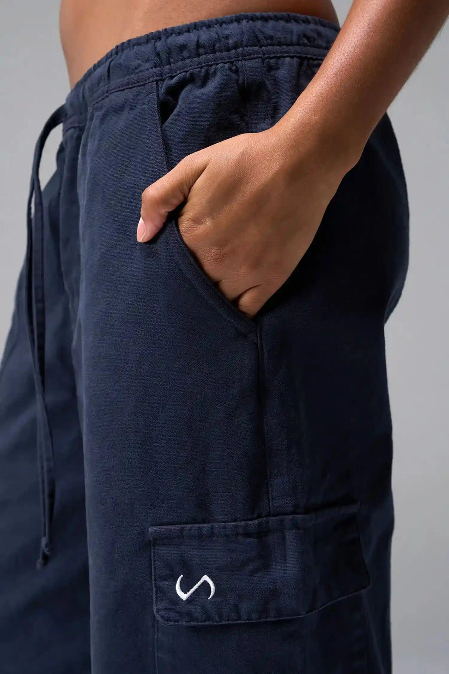 Front View of Blue the TLF Low Rise Oversized Cargo Joggers featuring a low-rise waistline, oversized & baggy fit and snap button cargo pockets