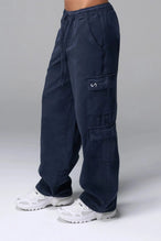 Front View of Blue the TLF Low Rise Oversized Cargo Joggers featuring a low-rise waistline, oversized & baggy fit and snap button cargo pockets