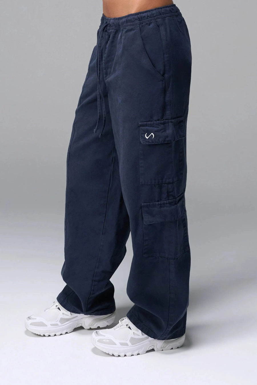 Front View of Blue the TLF Low Rise Oversized Cargo Joggers featuring a low-rise waistline, oversized & baggy fit and snap button cargo pockets