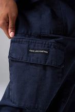 Detail View of Blue the TLF Low Rise Oversized Cargo Joggers featuring a low-rise waistline, oversized & baggy fit and snap button cargo pockets