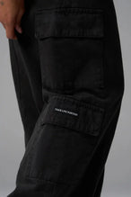 Back View of Black the TLF Low Rise Oversized Cargo Joggers featuring a low-rise waistline, oversized & baggy fit and snap button cargo pockets