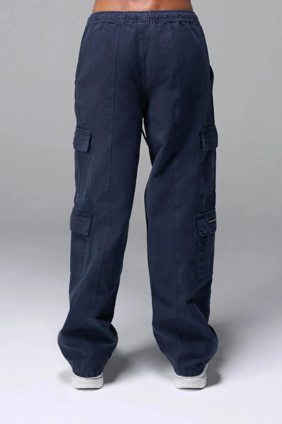 Back View of Blue the TLF Low Rise Oversized Cargo Joggers featuring a low-rise waistline, oversized & baggy fit and snap button cargo pockets