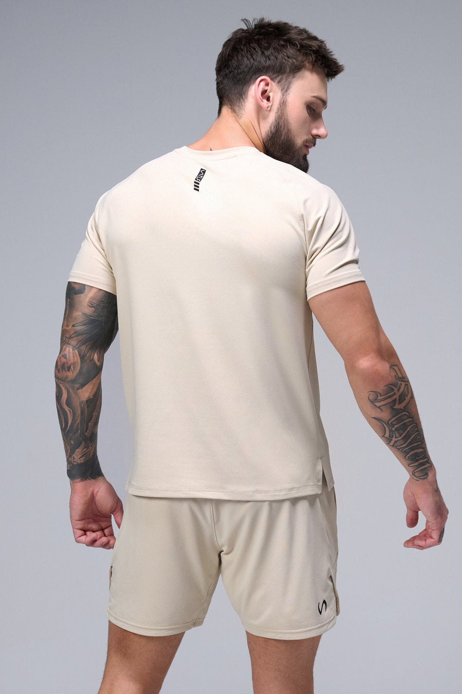 Back View of Oat Milk TLF Micro Mesh 6.5 Inch Shorts, featuring zippered pockets, 6.5” inch inseam and adjustable waistband