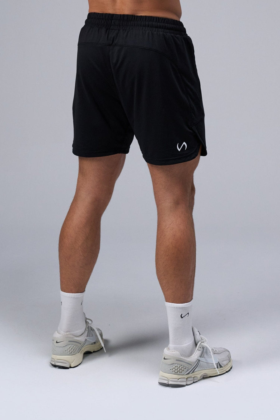 Back View of Black TLF Micro Mesh 6.5 Inch Shorts, featuring zippered pockets, 6.5” inch inseam and adjustable waistband