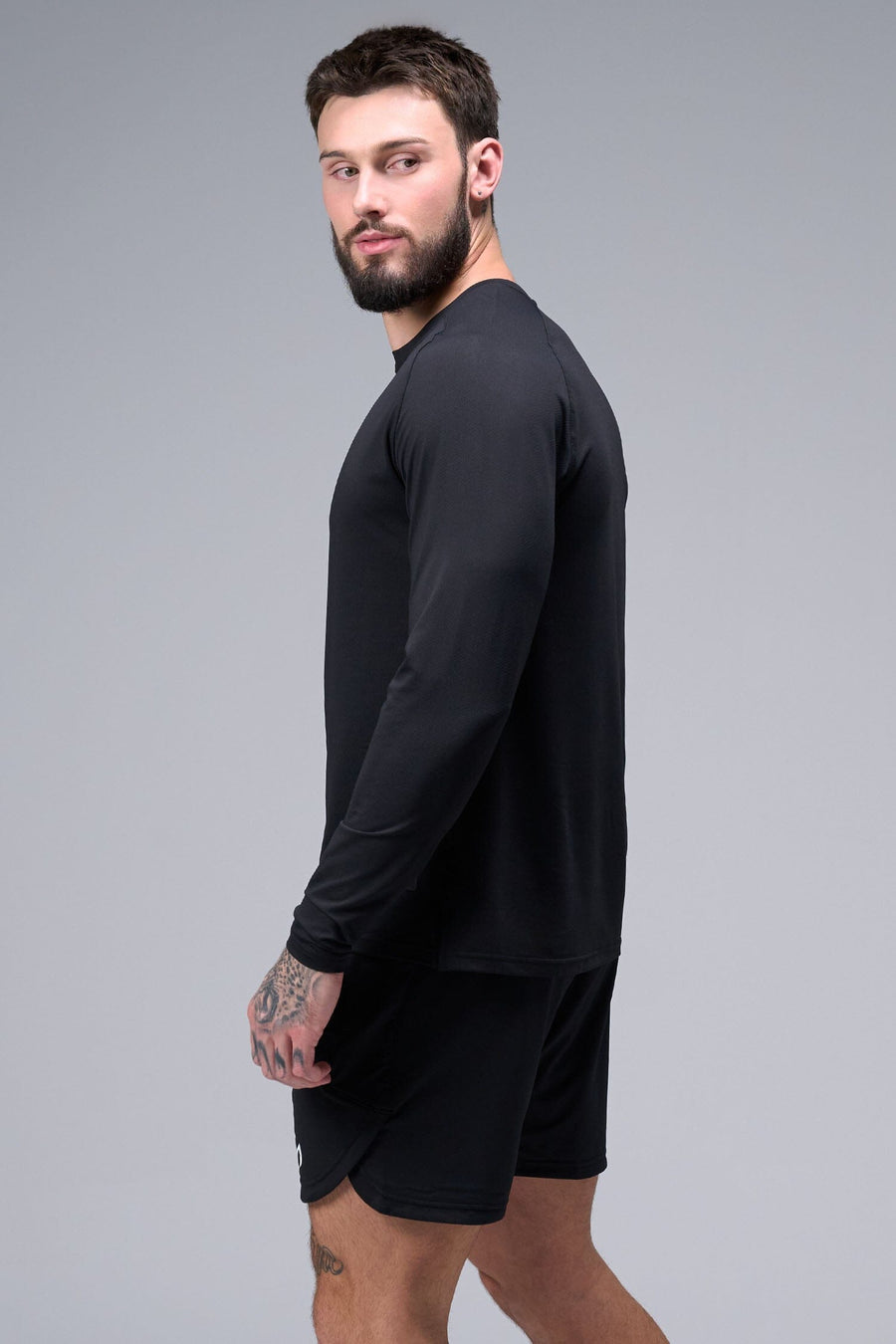 Left Side View of Black TLF Micro Mesh Long Sleeve Shirt, featuring raglan sleeves in Micro Mesh Fabric for breathability and performance