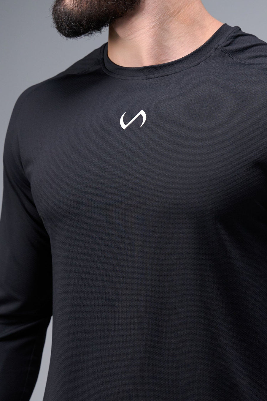 Detail Front View of Black TLF Micro Mesh Long Sleeve Shirt, featuring raglan sleeves in Micro Mesh Fabric for breathability and performance
