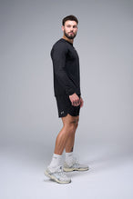 Right Side View of Black TLF Micro Mesh Long Sleeve Shirt, featuring raglan sleeves in Micro Mesh Fabric for breathability and performance
