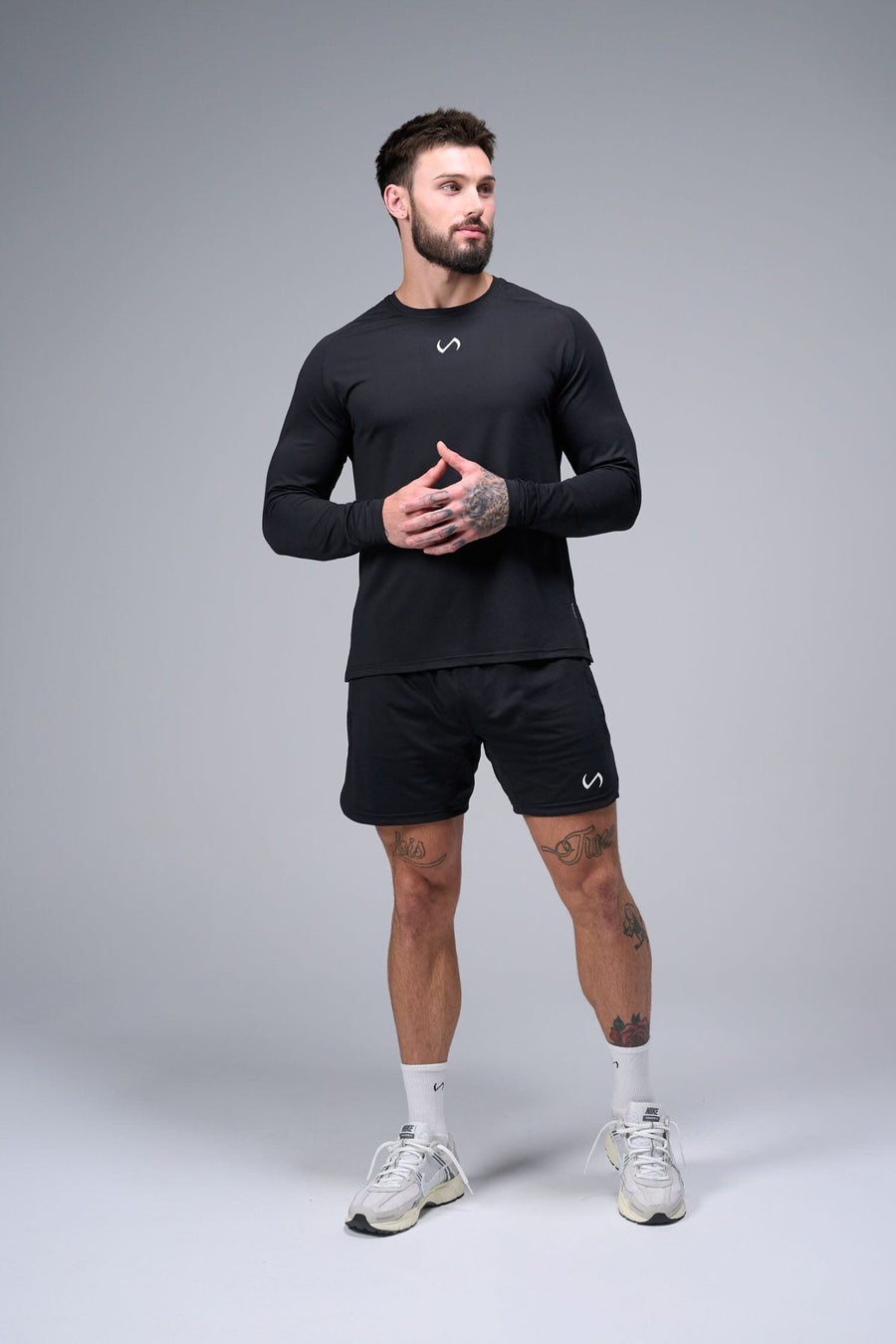 Front View of Black TLF Micro Mesh Long Sleeve Shirt, featuring raglan sleeves in Micro Mesh Fabric for breathability and performance