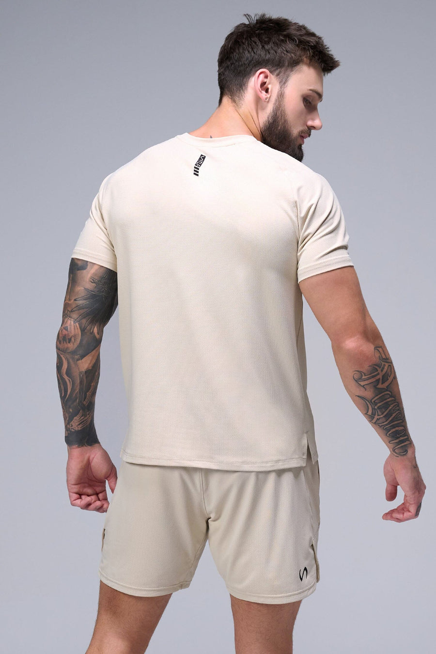 Back View of Oat Milk TLF Micro Mesh Tee, featuring raglan sleeves in performance Micro Mesh Fabric for breathability