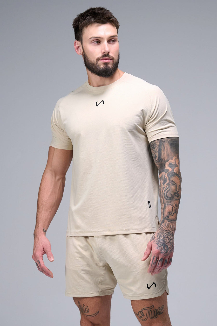 Front View of Oat Milk TLF Micro Mesh Tee, featuring raglan sleeves in performance Micro Mesh Fabric for breathability