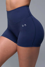 Front View of Blue TLF NeoCloud™ 4 Inch Secret Glute Seam Shorts featuring our new secret glute seam technology to lift and shape your glutes.