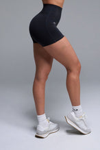 Side View of Black TLF NeoCloud™ 4 Inch Secret Glute Seam Shorts featuring our new secret glute seam technology to lift and shape your glutes.