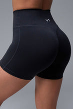 Back View of Black TLF NeoCloud™ 4 Inch Secret Glute Seam Shorts featuring our new secret glute seam technology to lift and shape your glutes.