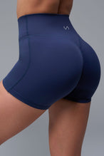 Back View of Blue TLF NeoCloud™ 4 Inch Secret Glute Seam Shorts featuring our new secret glute seam technology to lift and shape your glutes.