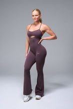 Front View of Brown TLF NeoCloud™ Flare Jumpsuit featuring a built-in low support sports bra with removable pads and adjustable straps
