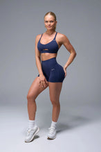 Front View of Blue TLF NeoCloud™ Keyhole Sports Bra featuring a strappy back and keyhole front design with low to medium support