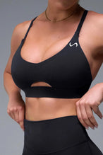 Front View of Black TLF NeoCloud™ Keyhole Sports Bra featuring a strappy back and keyhole front design with low to medium support