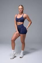 Front View of Blue TLF NeoCloud™ Keyhole Sports Bra featuring a strappy back and keyhole front design with low to medium support