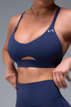 Front View of Blue TLF NeoCloud™ Keyhole Sports Bra featuring a strappy back and keyhole front design with low to medium support