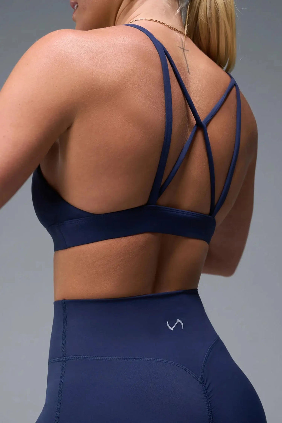 Back View of Blue TLF NeoCloud™ Keyhole Sports Bra featuring a strappy back and keyhole front design with low to medium support