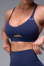 Front View of Blue TLF NeoCloud™ Keyhole Sports Bra featuring a strappy back and keyhole front design with low to medium support