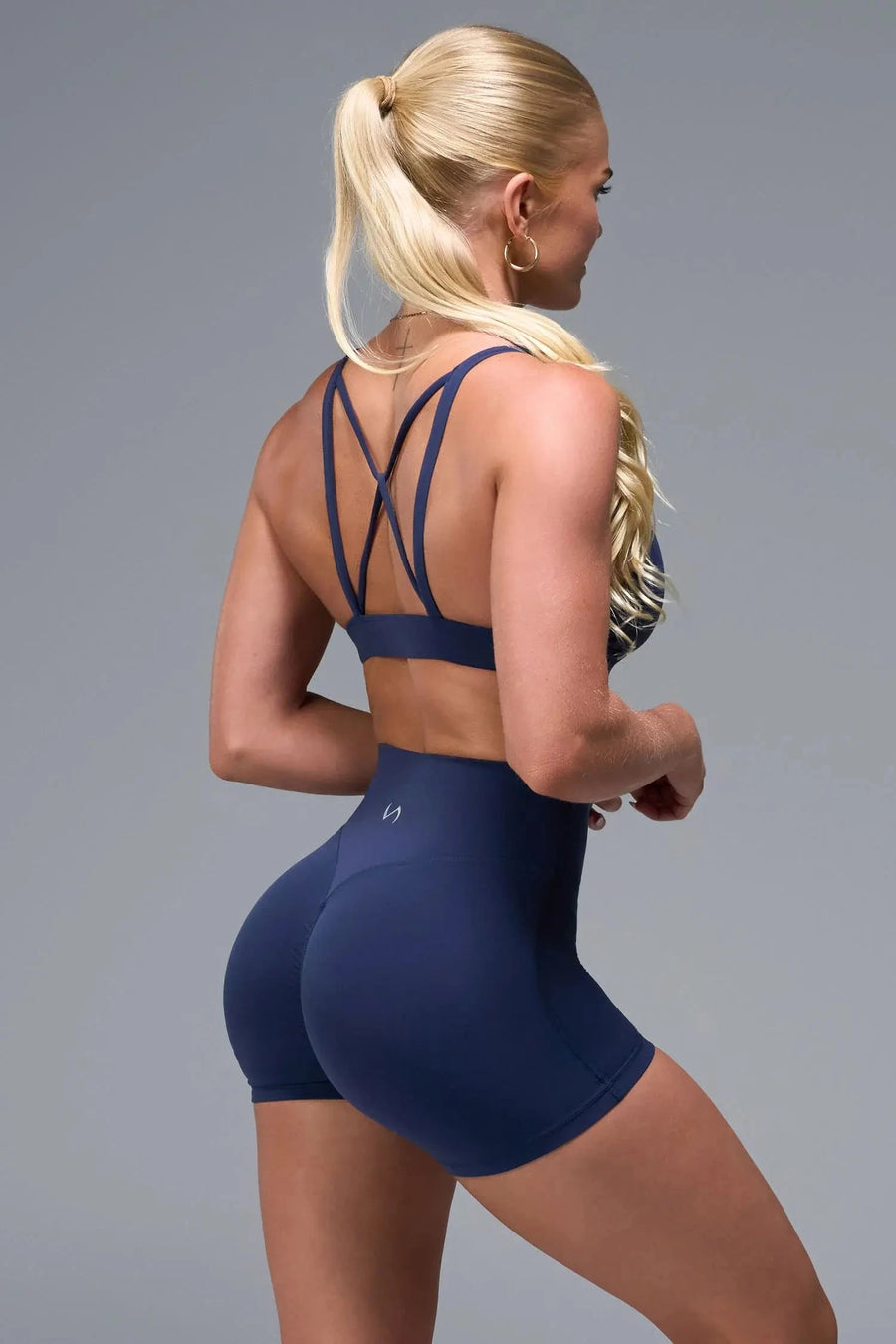 Back View of Blue TLF NeoCloud™ Keyhole Sports Bra featuring a strappy back and keyhole front design with low to medium support