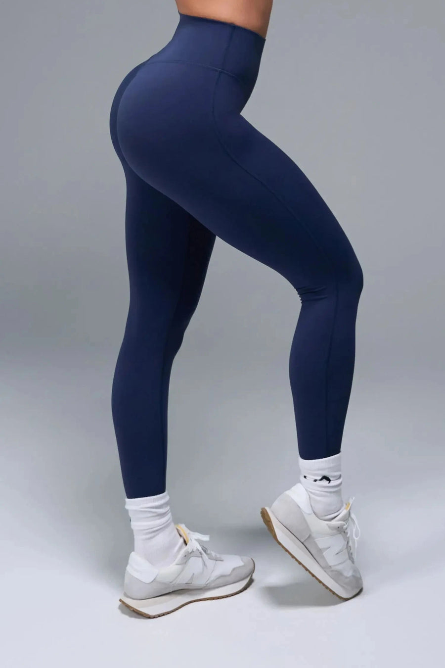 Side View of Blue TLF NeoCloud™ Secret Glute Seam Leggings featuring our new secret glute seam technology to lift and shape your glutes. 