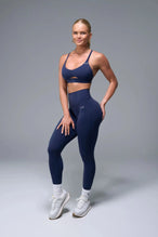 Side View of Blue TLF NeoCloud™ Secret Glute Seam Leggings featuring our new secret glute seam technology to lift and shape your glutes. 