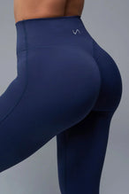 Back View of Blue TLF NeoCloud™ Secret Glute Seam Leggings featuring our new secret glute seam technology to lift and shape your glutes. 