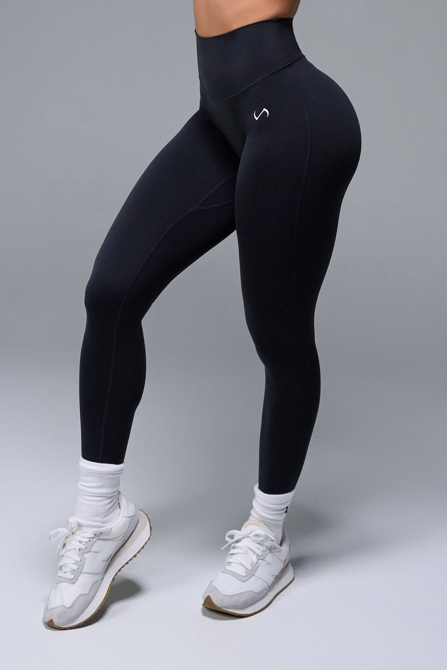 Front View of Black TLF NeoCloud™ Secret Glute Seam Leggings featuring our new secret glute seam technology to lift and shape your glutes. 