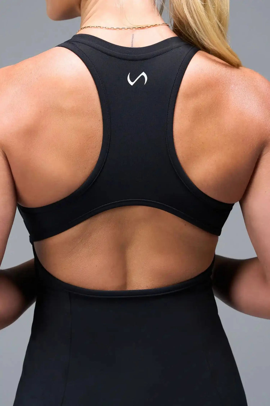 Back View of Black TLF NeoCloud™ Skort Dress featuring built in shorts with pockets, racerback design and built in sports bra with removable pads