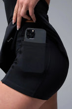 Detail Front View of Black TLF NeoCloud™ Skort Dress featuring built in shorts with pockets, racerback design and built in sports bra with removable pads