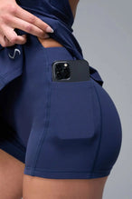 Detail View of Blue TLF NeoCloud™ Skort Dress featuring built in shorts with pockets, racerback design and built in sports bra with removable pads