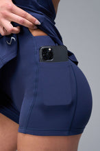 Front View of Blue TLF NeoCloud™ Skort Dress featuring built in shorts with pockets, racerback design and built in sports bra with removable pads