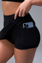 Detail View of Black TLF NeoCloud™ workout skirt featuring built in 2.5-inch inseam shorts and side pockets