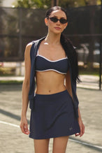 Front View of Blue TLF NeoCloud™ workout skirt featuring built in 2.5-inch inseam shorts and side pockets