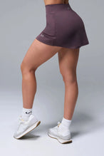 Side View of Brown TLF NeoCloud™ workout skirt featuring built in 2.5-inch inseam shorts and side pockets