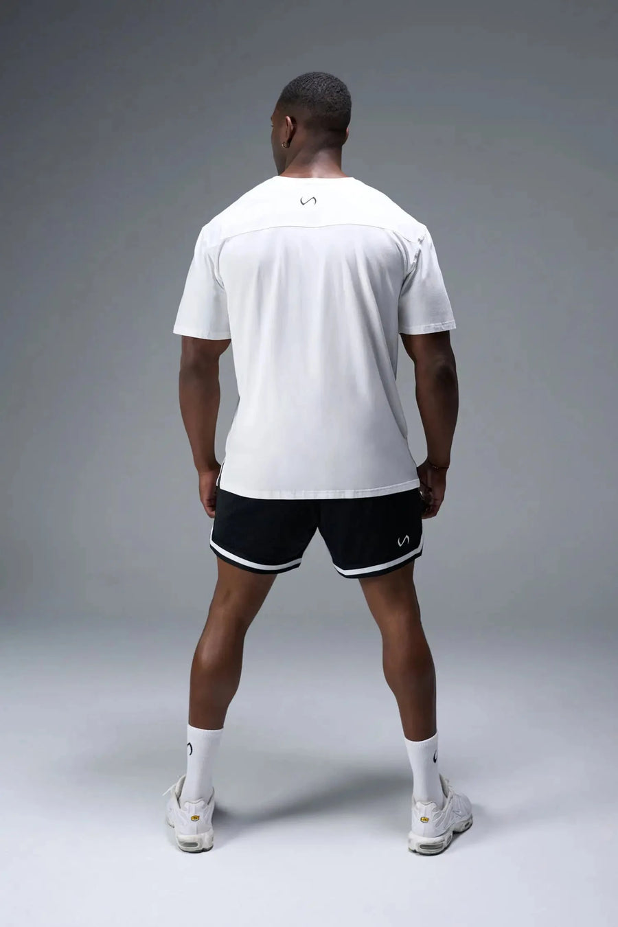 Front View of White TLF Property of Cotton Luxe Oversized Tee featuring a distressed graphic print design across the chest in our oversized t shirt fit