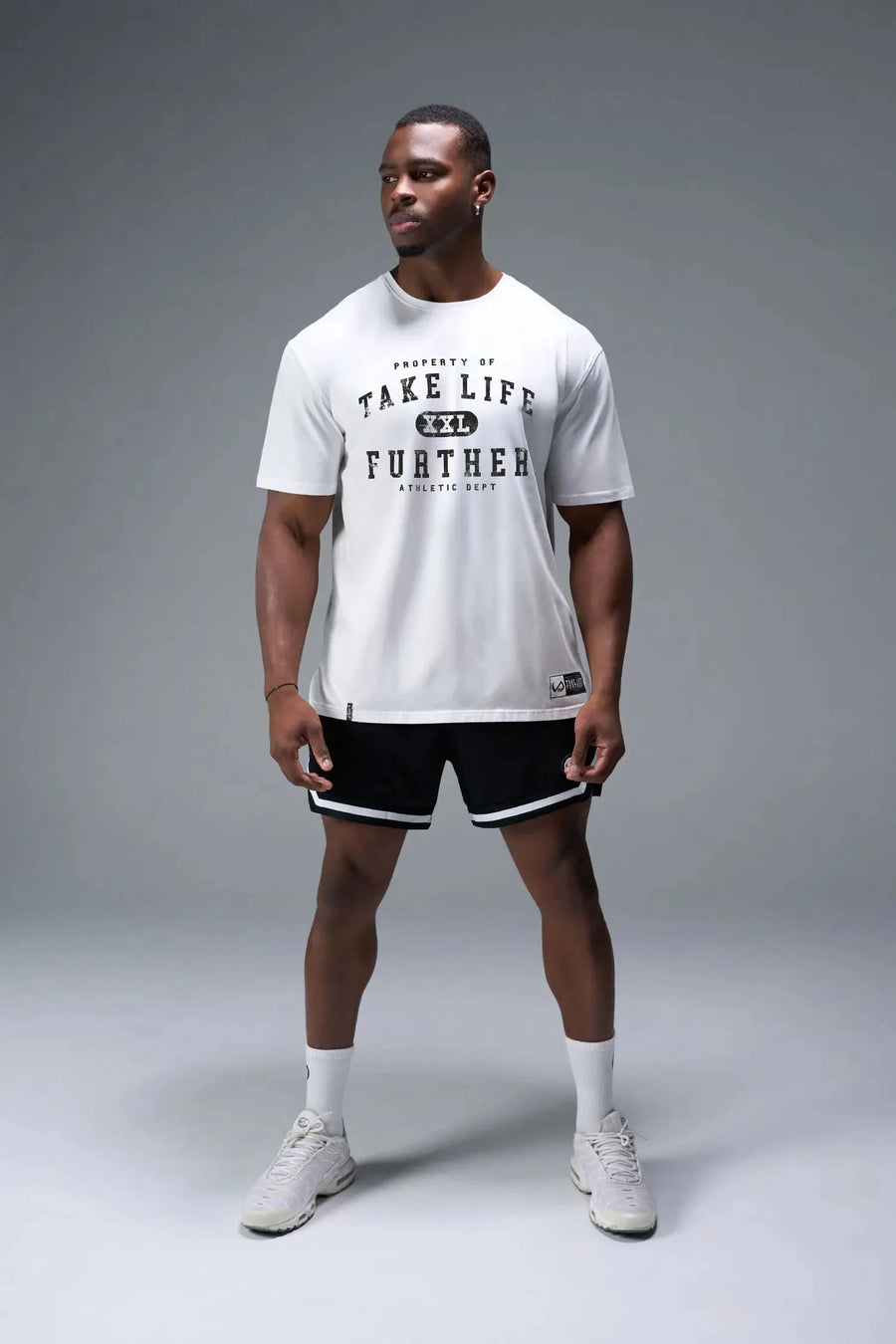 Front View of White TLF Property of Cotton Luxe Oversized Tee featuring a distressed graphic print design across the chest in our oversized t shirt fit