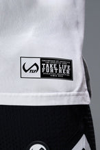 Detail Front View of White TLF Property of Cotton Luxe Oversized Tee featuring a distressed graphic print design across the chest in our oversized t shirt fit