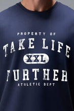 Detail Front View of Blue TLF Property of Cotton Luxe Oversized Tee featuring a distressed graphic print design across the chest in our oversized t shirt fit