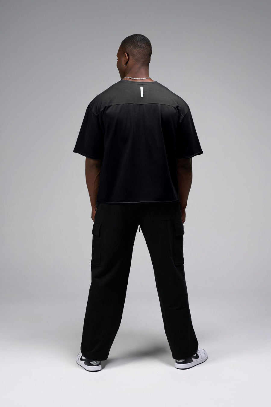 Back View Of Raw Edge Cropped Tee in Black