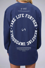 Back View of Blue the TLF Redefine Original Cotton Luxe Oversized LS Tee that features a bold back graphic in an oversized fit. 