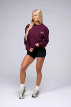 Front View of Red the TLF Redefine Original Cotton Luxe Oversized LS Tee that features a bold back graphic in an oversized fit. 