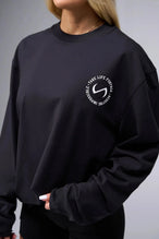 Front View of Black the TLF Redefine Original Cotton Luxe Oversized LS Tee that features a bold back graphic in an oversized fit. 