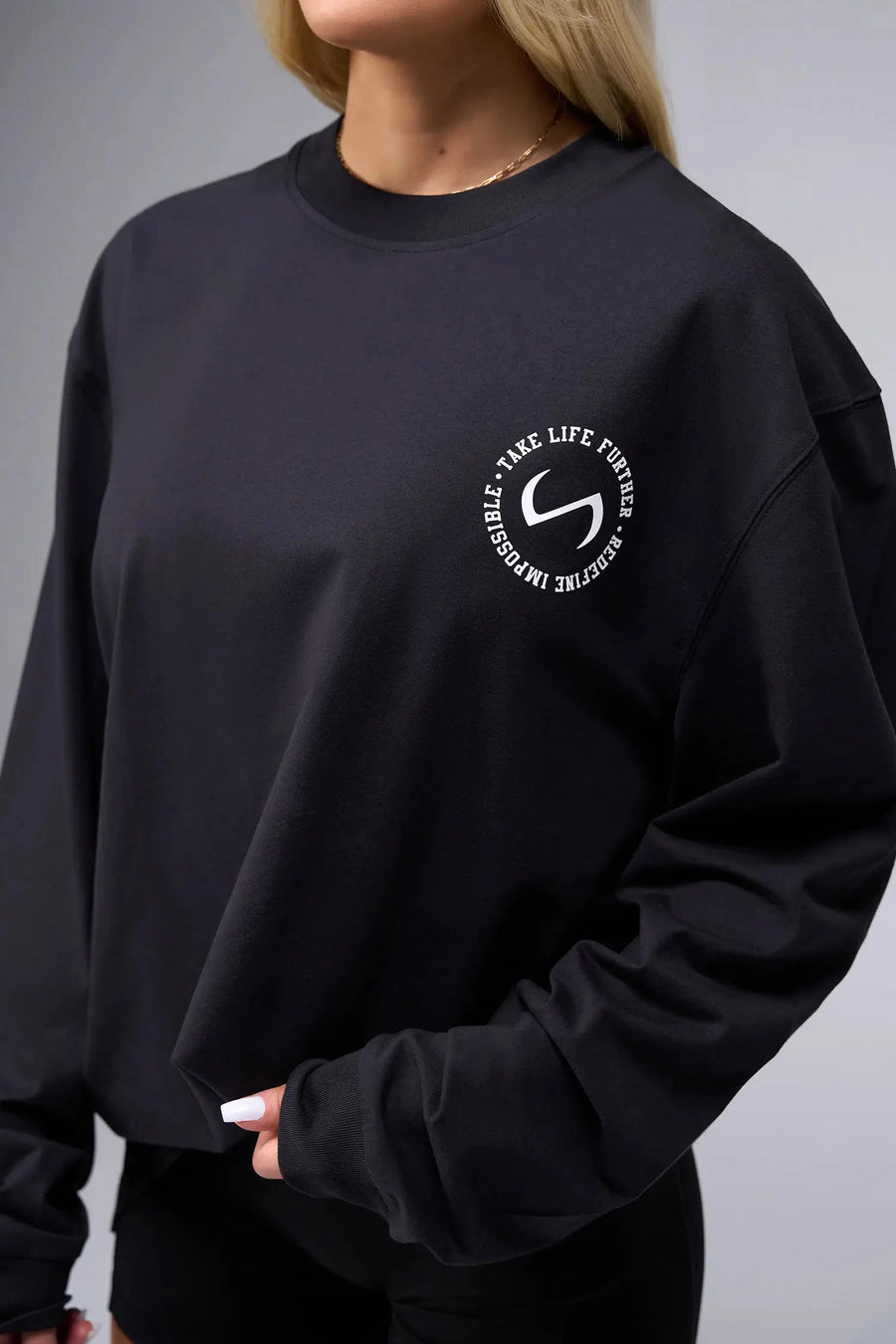 Front View of Black the TLF Redefine Original Cotton Luxe Oversized LS Tee that features a bold back graphic in an oversized fit. 