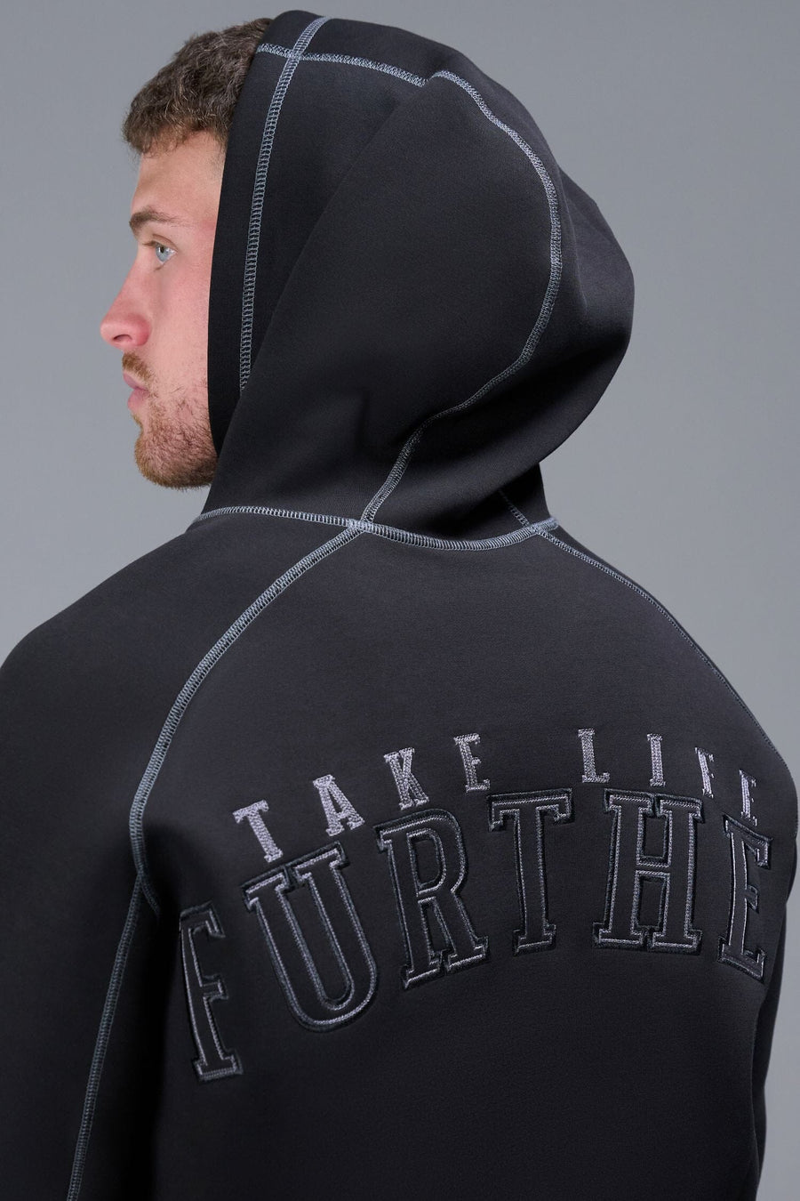 Detail Back View of Black TLF Scuba Tech Contrast Stitch Hoodie, featuring 3 panel hood, Kangaroo pockets and contrast stitching for streetwear aesthetic 