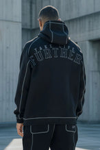 Back View of Black TLF Scuba Tech Contrast Stitch Hoodie, featuring 3 panel hood, Kangaroo pockets and contrast stitching for streetwear aesthetic 